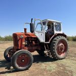 1.Vintage tractor outdoors with clear blue sky in Bulgaria.