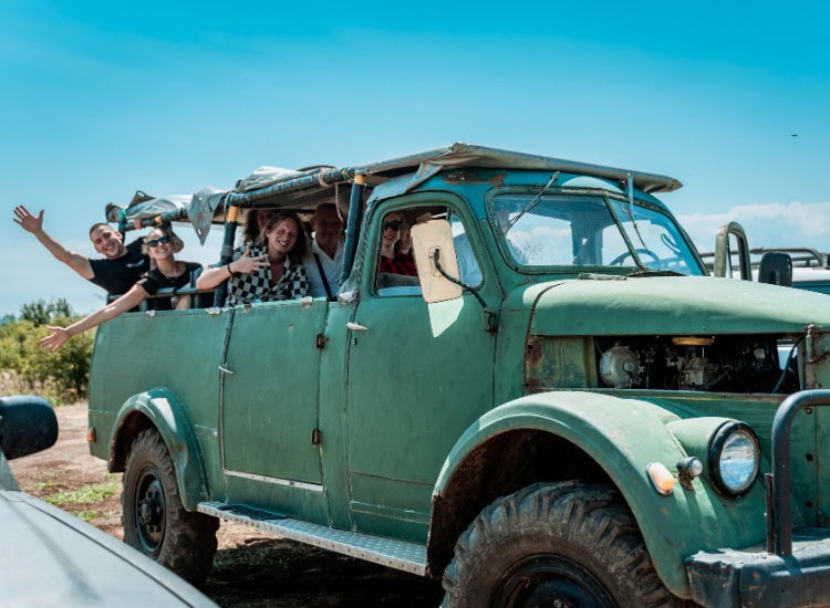 old car with tourists, Bulgaria, Hillview Bulgaria.