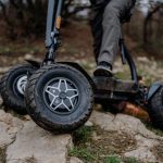 Young women with safe-looking motorcycles and helmets in nature, suitable for extreme sports Bulgaria.